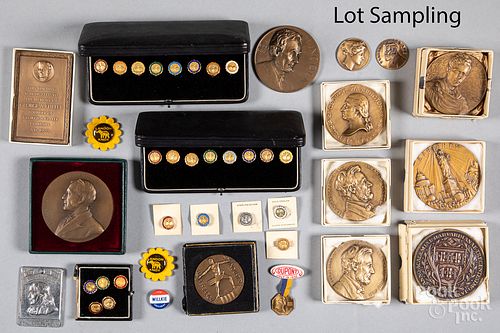 Collection of bronze medallions and pins