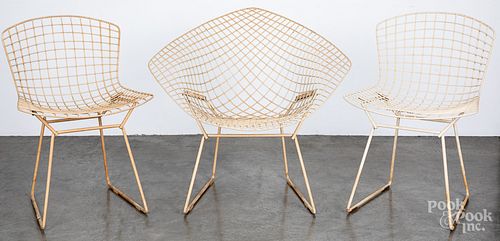 Six Bertoia wire chairs.