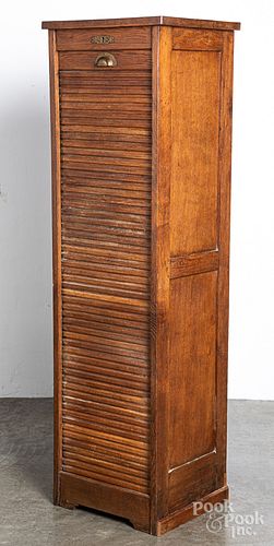 Oak cabinet with tambour door, early 20th c.