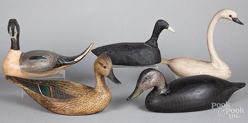 Four carved and painted duck decoys and a swan