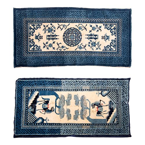 Lote de 2 alfombras. Origen Oriental. SXX. Anudadas a mano, en lana y algodón. Decorados con elementos vegetales y zoomorfos.