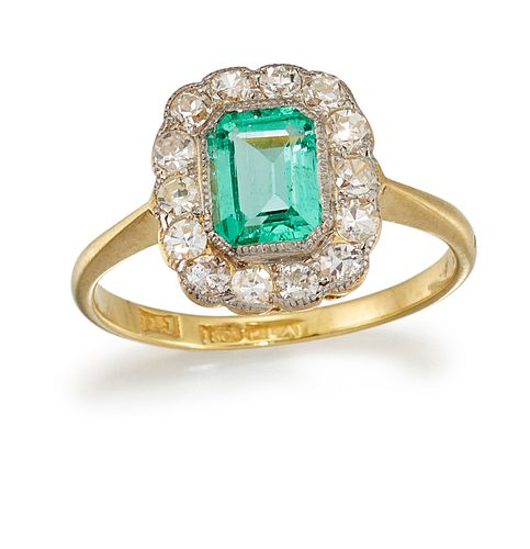 AN 18CT AND PLATINUM EMERALD AND DIAMOND CLUSTER RING, the emerald cut emer
