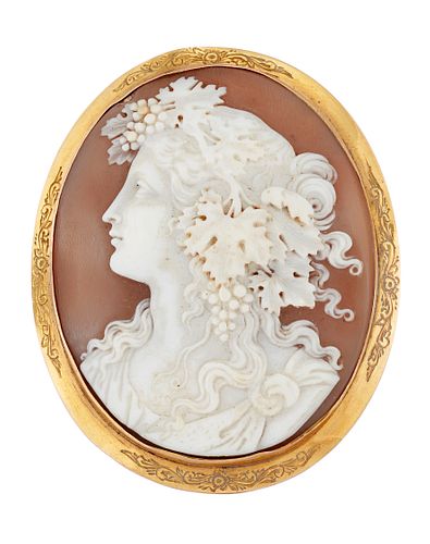A 9CT GOLD MOUNTED SHELL CAMEO, the oval shell cameo of Dionysus, with coll
