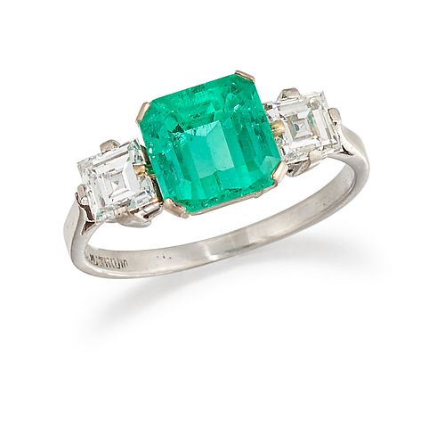 A PLATINUM EMERALD AND DIAMOND RING, the octagonal step cut emerald, 2.02ct
