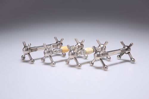 TWO PAIRS OF 19TH CENTURY SILVER-PLATED KNIFE RESTS, one pair with ivory mo