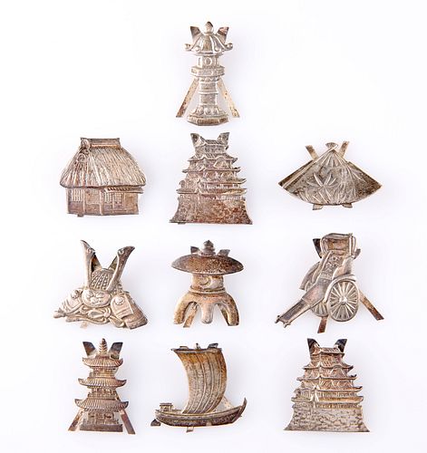 A SET OF TEN CHINESE SILVER PLACE CARD HOLDERS, each with easel back, desig