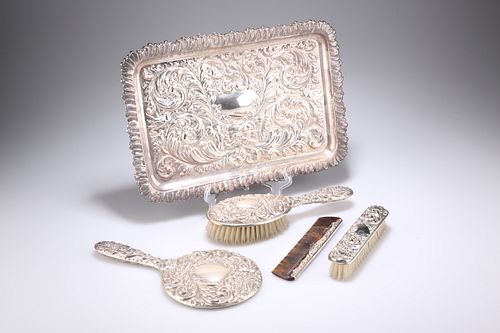 A DRESSING TABLE SET, comprising a silver-backed mirror, silver-mounted com
