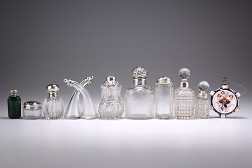 A COLLECTION OF SEVEN VICTORIAN AND LATER SILVER-MOUNTED BOTTLES, including