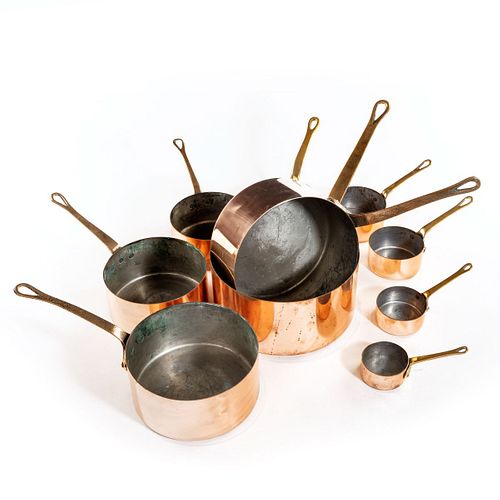 Collection of 10 vintage graduating copper pans with brass handles, circa 1930 - Courtesy William Cook Antiques, UK