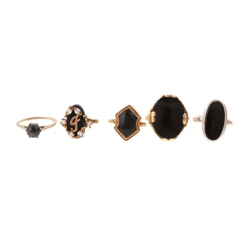 An Assortment of Black Onyx Rings in Gold
