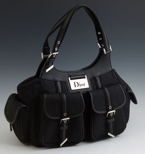 Christian Dior Medium Detective Black Monogram Canvas Bag, with silver hardware, the magnetic snap button closure opening to a lined...