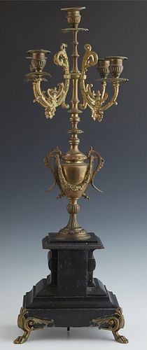 French Bronze and Marble Five Light Candelabra, c. 1900, with a central candle cup, flanked by four lower curved arms with candle cu...