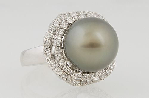 Lady's 14k White Gold Dinner Ring with a 13.88 mm Round Dark Gray Tahitian Natural Pearl, atop an undulating border of small round d...