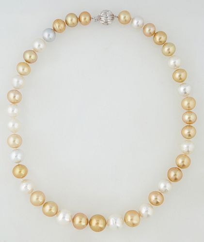 Strand of 39 Graduated White and Golden South Seas Cultured Pearls, ranging from 10-13 mm, with a 14k White Gold ball clasp, L.- 17...