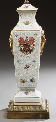 English Porcelain Table Lamp, early 20th c., of tapered square form, with enamel relief floral and armorial decoration, on a socle s...