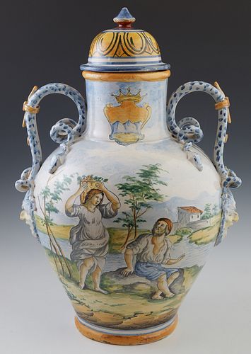 Large French Provincial Style Style Footed Faience Covered Jar, 19th c., of tapered baluster form, the sides with applied snake handles, over a floral