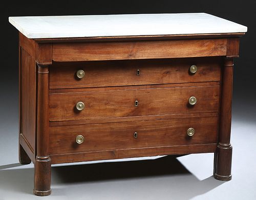 French Empire Style Carved Cherry Marble Top Commode, 19th c., the figured white marble over a frieze drawer and three setback drawers, flanked by ful