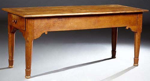French Provincial Carved Elm Farmhouse Table, 19th c., with two large end drawers, on a scrolled skirt on tapered octagonal legs, H.- 30 3/4 in., W.- 
