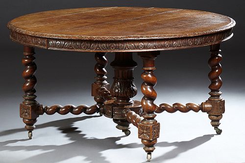 French Louis XIII Style Carved Oak Dining Table, 19th c., the rounded carved edge circular top on a turned and carved urn center support and four rope