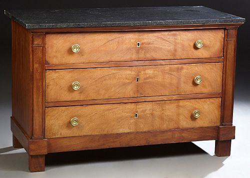 French Empire Style Carved Walnut Marble Top Commode, 19th c., the highly figured black marble over three setback deep drawers, with original ormolu p