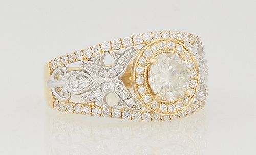 Lady's 18K Yellow Gold Dinner Ring, with a central .83 ct. round diamond, flanked by pierced diamond mounted sides and diamond mounted edge borders, t