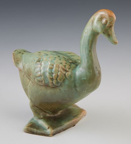 Shearwater Pottery Figure of a Duck, c. 1935, in an antique green glaze, H.- 8 1/2 in., W.- 5 1/2 in., D.- 8 1/4 in. Provenance: Personal collection o