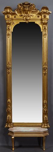 Empire Style Gilt and Gesso Pier Mirror, 19th c., perhaps by L. Uter, New Orleans, the arched outward crest with a relief Athena head, flanked by outw
