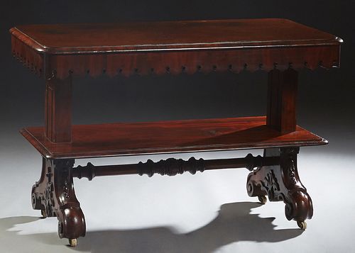 American Carved Mahogany Three Tier Metamorphic Serving Trolley, c. 1850, with a pierced Gothic trefoil skirt, the whole on splayed scrolled legs with