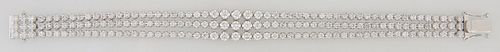 14K White Gold Tennis Bracelet, composed of three parallel strands with 56 round diamonds each, total diamond wt.- 6.52 cts., L- 6 3/4 in., with appra