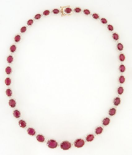 14K Yellow Gold Link Necklace, each of the 36 oval links with a graduated oval ruby atop a border of small round diamonds, total ruby wt.- 77.47 cts.,
