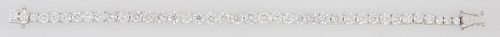 18K White Gold Tennis Bracelet, each of the 39 links with a graduated round diamond, total diamond wt.- 12.84 cts., L.- 7 in., with appraisal.