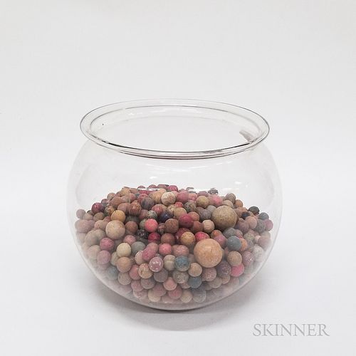 Large Group of Clay Marbles in a Colorless Blown Glass Fishbowl.