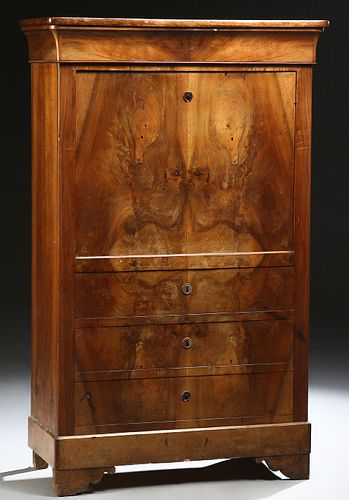 French Provincial Louis Philippe Carved Walnut Secretary Abattant, 19th c., the rounded corner and edge top over a cavetto frieze drawer and a fall fr