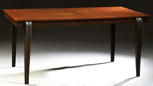 French Carved Mahogany Art Deco Style Dining Table, 20th c., the crotched top over a wide skirt, on reeded cabriole legs, the sides with pullout leaf 