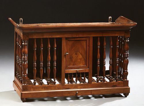 French Provincial Carved Walnut Panettiere, 19th c., the ogee crown over a central door, flanked by turned spindles and like sides, on turned legs,, H