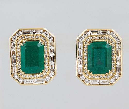 Pair of 18K Yellow Gold Earrings, each with a large 3.5 carat emerald atop an octagonal border of round diamonds, and an outer border of round and bag
