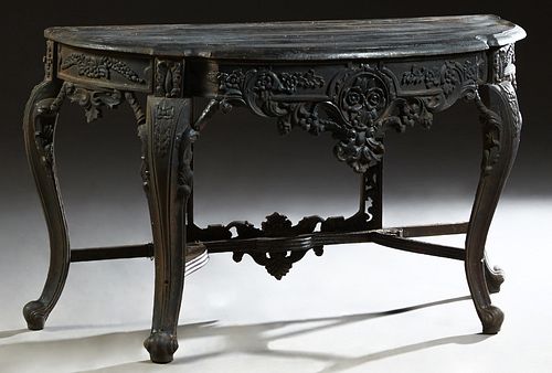 Victorian Style Cast Iron Demilune Console Table, 21st c., the stepped shaped demilune top over a pierced floral relief skirt, on scrolled cabriole le