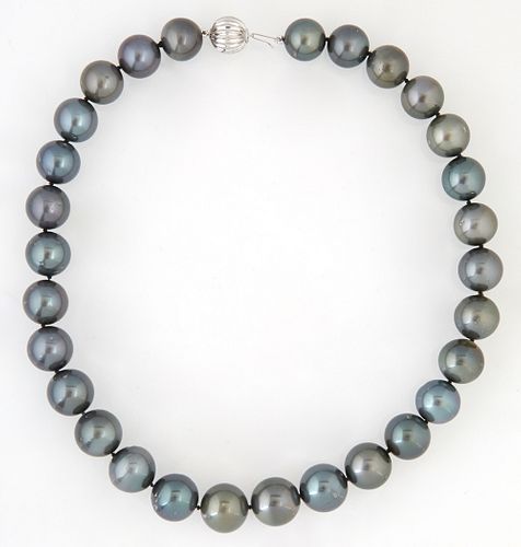 Graduated Strand of 29 Gray Tahitian Cultured Pearls, ranging from 13-15mm, with a 14K white gold ball clasp, L.- 17 in.