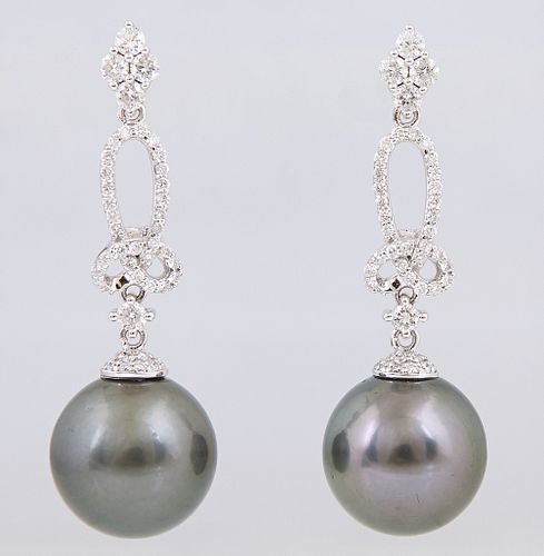 Pair of 14K White Gold Pendant Earrings, the diamond mounted stud to a diamond mounted loop, suspending a dark gray 13mm Tahitian cultured pearl, with
