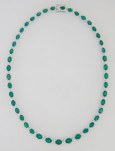 18K White Gold Link Necklace, each of the 43 oval links with a graduated oval emerald atop a border of small round diamonds, total emerald weight- 29.