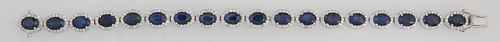 18K White Gold Link Bracelet, each of the 18 oval links with an oval sapphire atop a border of round diamonds, total sapphire wt.- 19.8 cts., total di