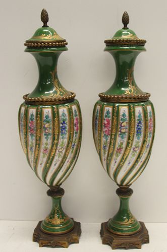 Pair Of Bronze Mounted Sevres Porcelain Urns.