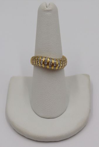 JEWELRY. 18kt Gold and Diamond "Wave" Band Ring.