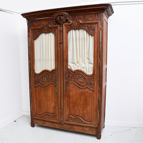 Nice French antique carved walnut armoire