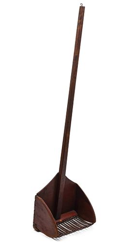 AN UNUSUAL LONG HANDLED CRANBERRY SCOOP IN RED STAIN