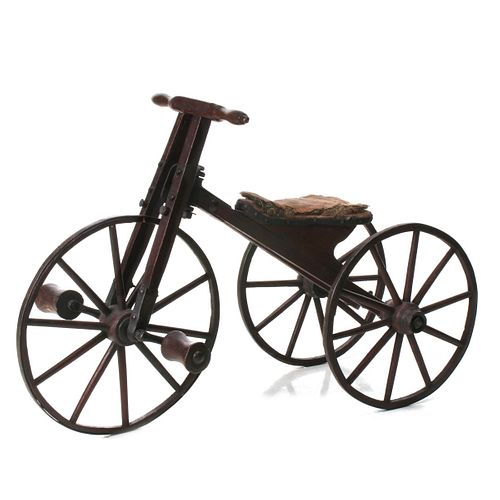 A 19TH C. BONE SHAKER TRICYCLE IN ORIGINAL RED PAINT