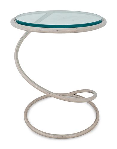 A Mid-Century Polished Chrome and Glass Spring Table
Height 18 1/4 x diameter 13 3/4 inches.