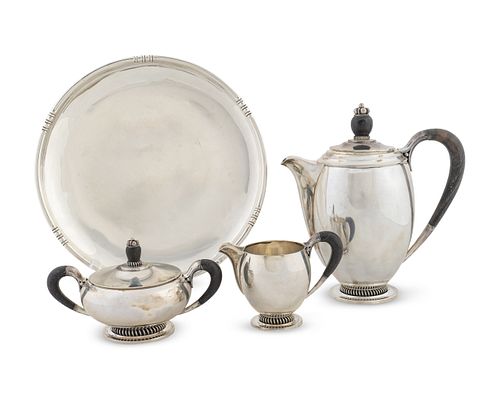 A Danish Silver Three-Piece Tea Set and a Fina Circular Silver Tray