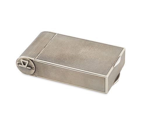 An Italian Silver Compact
Height 3/4 x length 3 3/4 x width 2 1/8 inches.