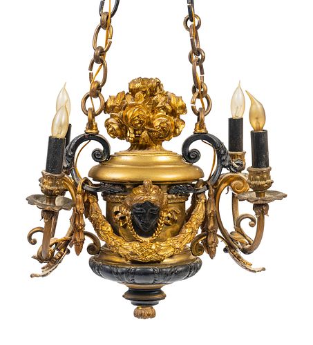 A Renaissance Style Parcel-Gilt and Patinated Bronze Four-Light Chandelier
Height 14 x width 15 inches.